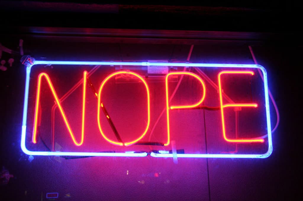 a lightened board stating NOPE
