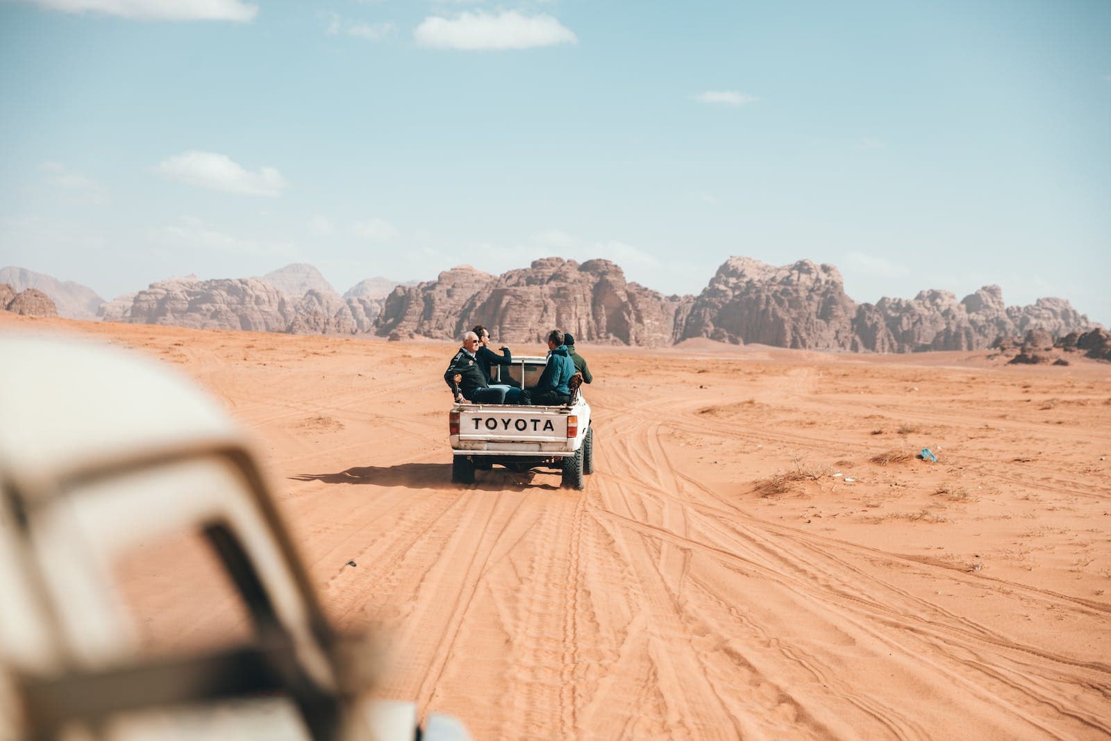 Photo of People Riding on a Toyota Pickup Truck