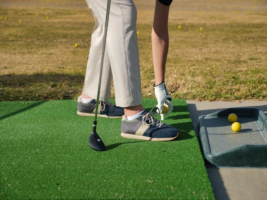 Person Putting a Ball on a Tee