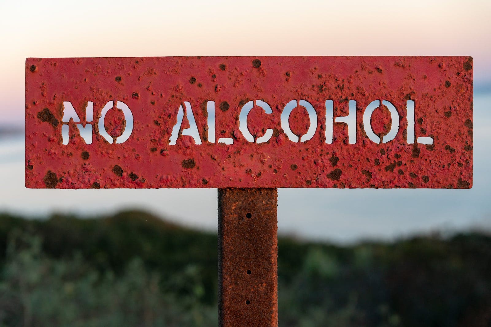 A Red Text Signage Stating No Alcohol