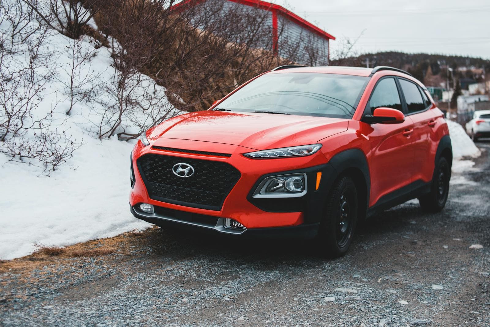 Red Hyundai Car Parked Near Snow Covered Ground