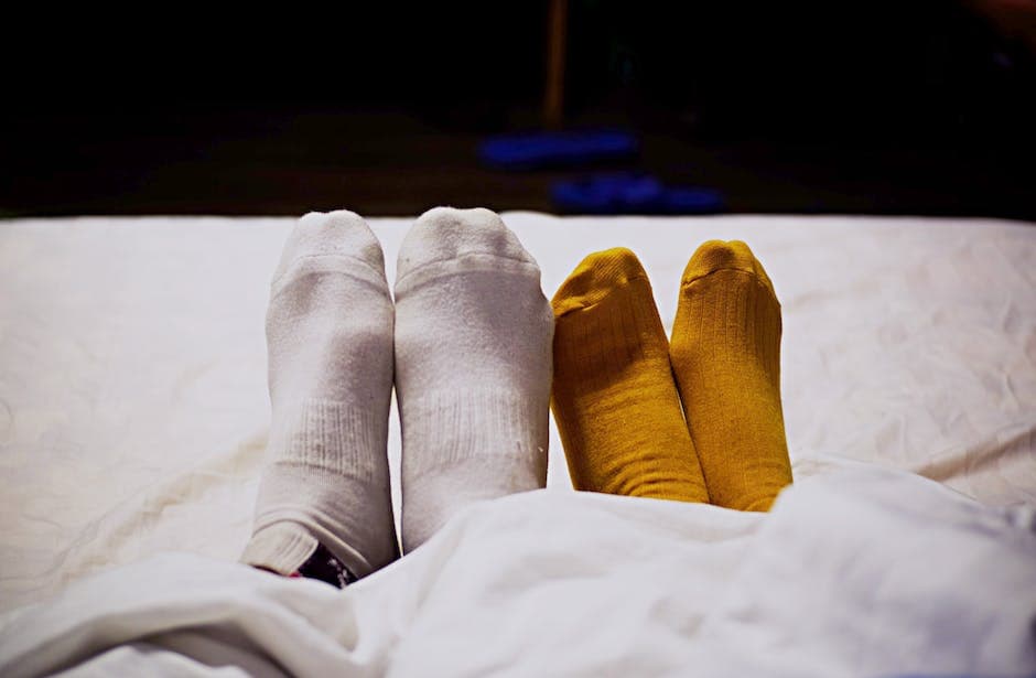 Person in White Pants and Yellow Socks